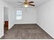 Bedroom featuring neutral carpet, window with blinds and ceiling fan at 2530 Marlin Dr, Mcdonough, GA 30253