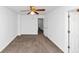 Bedroom featuring neutral carpet, ceiling fan, and white trim at 2530 Marlin Dr, Mcdonough, GA 30253