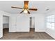 Bedroom with neutral carpet, ceiling fan, and attached bathroom at 2530 Marlin Dr, Mcdonough, GA 30253