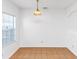 Bright dining area with a modern light fixture and natural lighting at 2530 Marlin Dr, Mcdonough, GA 30253