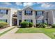 Charming townhome featuring a well-manicured lawn and neutral siding at 2530 Marlin Dr, Mcdonough, GA 30253