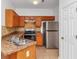 Functional kitchen with stainless steel appliances and wood cabinets at 2530 Marlin Dr, Mcdonough, GA 30253