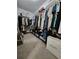 Walk-in closet with ample storage and organization with a Prada shopping bag at 261 Mahone Dr, Lilburn, GA 30047