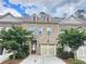 Attractive brick townhouse with a well-maintained lawn and a one car garage at 261 Mahone Dr, Lilburn, GA 30047