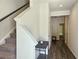 Inviting foyer with hardwood floors, staircase, and neutral color palette at 261 Mahone Dr, Lilburn, GA 30047