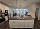 Spacious kitchen island with granite countertops and ample cabinet space at 261 Mahone Dr, Lilburn, GA 30047