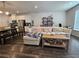 Inviting living room featuring a comfortable couch, hardwood floors, and plenty of natural light at 261 Mahone Dr, Lilburn, GA 30047