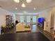 Bright living room with hardwood floors, a comfortable couch, and natural light at 261 Mahone Dr, Lilburn, GA 30047