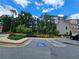 Community mailboxes with bench seating near a handicap parking space at 261 Mahone Dr, Lilburn, GA 30047