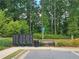 Community mailboxes with bench seating situated amongst landscaped greenery at 261 Mahone Dr, Lilburn, GA 30047