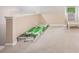 Carpeted attic space with boxes of flooring and a chair at 300 Wesfork Nw Way, Suwanee, GA 30024