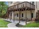 Back deck with a seating area underneath and stairs to the backyard at 300 Wesfork Nw Way, Suwanee, GA 30024