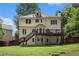 Spacious backyard with a deck and grassy area for outdoor enjoyment at 300 Wesfork Nw Way, Suwanee, GA 30024