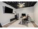 Finished basement area featuring work-from-home space, exposed ceiling, and laminate flooring at 300 Wesfork Nw Way, Suwanee, GA 30024