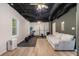 Finished basement features laminate flooring, exposed ceiling, and home gym at 300 Wesfork Nw Way, Suwanee, GA 30024