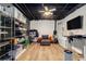 Finished basement space with laminate flooring, exposed ceiling, and dedicated storage at 300 Wesfork Nw Way, Suwanee, GA 30024