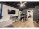 Finished basement with exposed ceiling, laminate flooring, and additional space at 300 Wesfork Nw Way, Suwanee, GA 30024