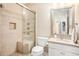 Bathroom featuring tiled shower, updated vanity and fixtures at 300 Wesfork Nw Way, Suwanee, GA 30024