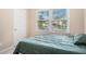 Cozy bedroom with plush bedding and ample natural light at 300 Wesfork Nw Way, Suwanee, GA 30024