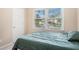 Cozy bedroom with a comfortable bed and ample natural light at 300 Wesfork Nw Way, Suwanee, GA 30024