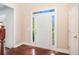 Welcoming foyer with hardwood floors, a bright white front door, and sidelights, creating an inviting entrance at 300 Wesfork Nw Way, Suwanee, GA 30024