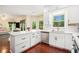 Modern kitchen with white cabinets, stainless steel appliances, and center island at 300 Wesfork Nw Way, Suwanee, GA 30024