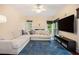 Living room with large sectional sofa, recessed lighting, and a fireplace at 300 Wesfork Nw Way, Suwanee, GA 30024