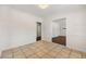Dining room with tile floors showing doorways into multiple rooms with hardwood flooring at 3723 Glenwood Rd, Decatur, GA 30032