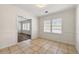Cozy dining room featuring neutral tile flooring and access to an adjacent room with wood floors at 3723 Glenwood Rd, Decatur, GA 30032