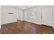 Bright and airy living room with hardwood floors and a white front door at 3723 Glenwood Rd, Decatur, GA 30032