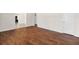 Inviting living room featuring hardwood floors and an open layout into the kitchen at 3723 Glenwood Rd, Decatur, GA 30032