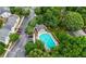 Aerial view of community pool and clubhouse with surrounding townhomes at 1135 Kilmington Ct, Alpharetta, GA 30009