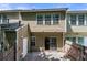 Back of home with sliding glass door onto a patio and fenced yard at 1135 Kilmington Ct, Alpharetta, GA 30009