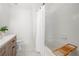 Bright bathroom featuring a tub with shower, ceramic tile, and vanity with storage at 1135 Kilmington Ct, Alpharetta, GA 30009