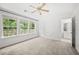 Bright bedroom with large windows and ample closet space, leading to ensuite bathroom at 1135 Kilmington Ct, Alpharetta, GA 30009