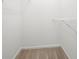 Spacious walk-in closet with carpet and shelving at 1135 Kilmington Ct, Alpharetta, GA 30009