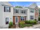 Charming townhome featuring classic architecture and a welcoming front garden area at 1135 Kilmington Ct, Alpharetta, GA 30009
