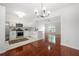 Open kitchen featuring stainless steel appliances, modern fixtures and marble countertops at 1135 Kilmington Ct, Alpharetta, GA 30009
