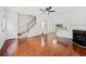 Bright, open-concept living room with hardwood floors and a cozy fireplace at 1135 Kilmington Ct, Alpharetta, GA 30009