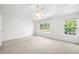 Bright main bedroom with a ceiling fan and large windows at 1135 Kilmington Ct, Alpharetta, GA 30009