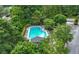 Aerial view of a community pool surrounded by lush trees and lounge chairs at 1135 Kilmington Ct, Alpharetta, GA 30009