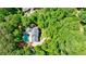 From above, a home is nestled within a canopy of vibrant green trees at 1348 Timberland Se Dr, Marietta, GA 30067