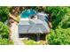 Drone view of a home, landscaped grounds, private pool, and backyard at 1348 Timberland Se Dr, Marietta, GA 30067