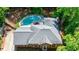 Aerial view of home showcasing pool, patio area, landscaping, and backyard privacy at 1348 Timberland Se Dr, Marietta, GA 30067