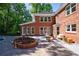 Beautiful brick home with a spacious backyard, pool, and outdoor seating area at 1348 Timberland Se Dr, Marietta, GA 30067