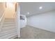 Finished basement featuring stairs to the main level, neutral carpet, and fresh white paint in an open floor plan at 1348 Timberland Se Dr, Marietta, GA 30067