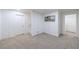 Finished basement with neutral carpet, fresh white paint, doorways to other rooms, and stairs to the main level at 1348 Timberland Se Dr, Marietta, GA 30067