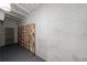 Basement with exposed brick, painted floor, and wooden wine rack at 1348 Timberland Se Dr, Marietta, GA 30067