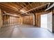 Unfinished basement with painted floors, exposed wood and easy access to utilities at 1348 Timberland Se Dr, Marietta, GA 30067