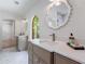 New bathroom featuring a vanity with an elegant mirror, quartz countertop, and shaker cabinets at 1348 Timberland Se Dr, Marietta, GA 30067
